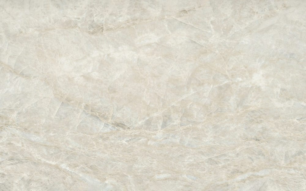 Light marble surface in beige and gray with fine grain and subtle veins.